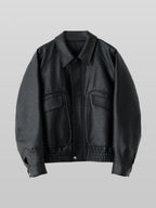 Artificial Grain Flight Blouson black – Front view | architectural outerwear / structured | UNPROVEN