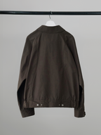 Curved Blouson Jacket brown – Back view | architectural outerwear / structured | UNPROVEN