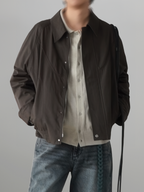 Curved Blouson Jacket brown – Front view | architectural outerwear / structured | UNPROVEN