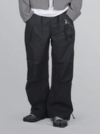 Nylon Zip Pants black – Front view | wide-leg / pleated / relaxed tailoring | UNPROVEN